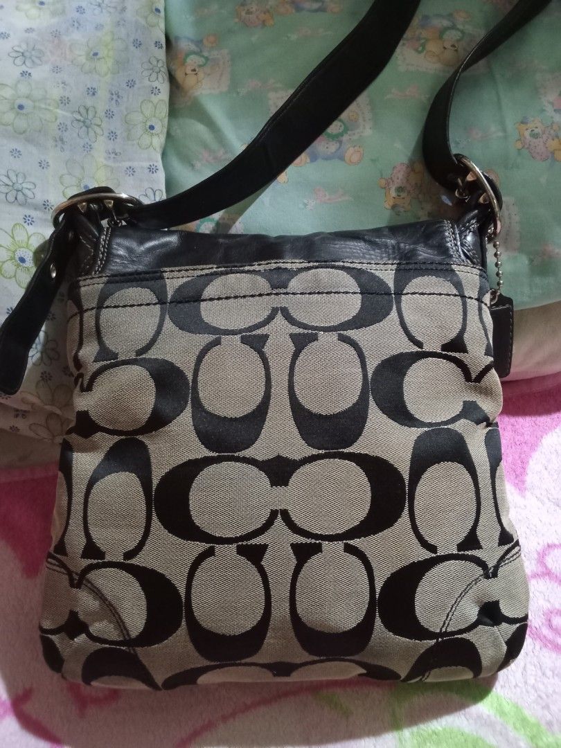 Coach Monogram Canvas Leather cross bodyBag (Category: Luxury Bags & Wallets) located in Manila. Submitted by aradoanita90032 (Listing ID 1461430301, Image 3). Description: - Classic Coach shoulder bag - Signature monogram canvas with black leather trim - Silver buckle detail on the front flap - Adjustable leather strap - Great everyday bag - Plenty of space inside.
