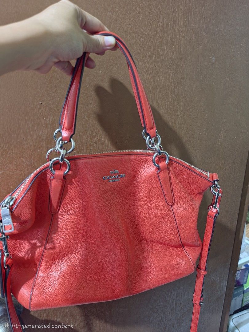 Coach Pebbled Leather Satchel Handbag (Category: Luxury Bags & Wallets) located in Cebu City. Submitted by mjcolinacebu20 (Listing ID 1461409773, Image 1). Description: - Orange pebbled leather Coach satchel - Silver hardware details - Top handles and detachable crossbody strap - Secure zipper closure - Interior: zippered pocket and slip pockets - Minor marks on interior lining ( kamo nlng limpyo sa inside as seen in the picture) - Ideal for ever
