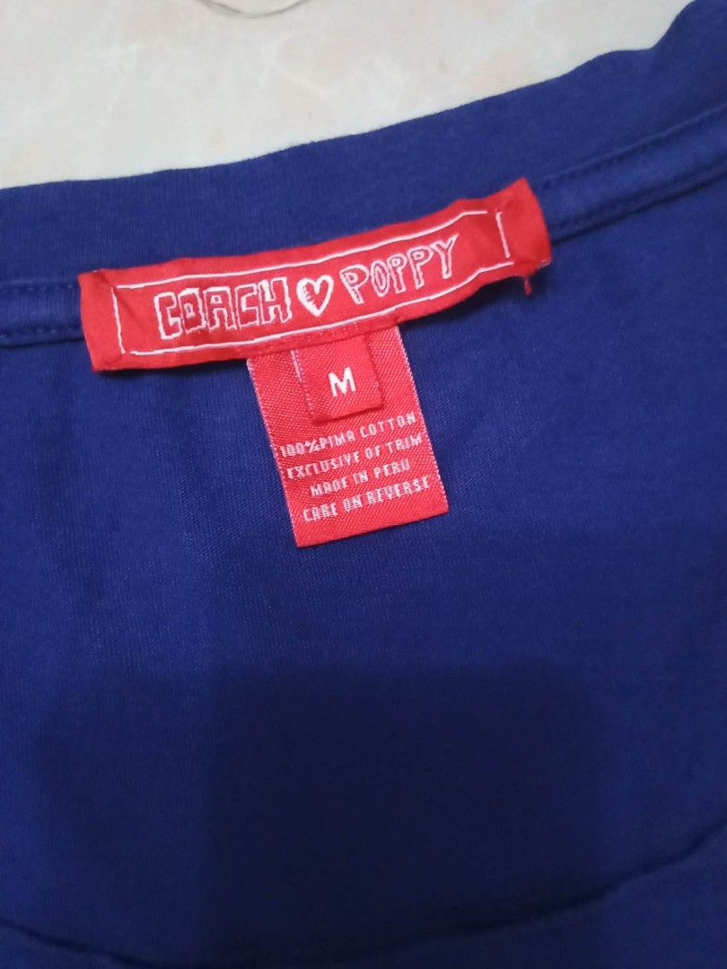 Coach Poppy Vintage Tshirt (Category: Luxury Apparel) located in San Fernando. Submitted by avylll_thrift (Listing ID 1461338090, Image 2). Description: Coach Poppy Vintage Tshirt Deep Blue color in actual little crack print overall: 8/10.