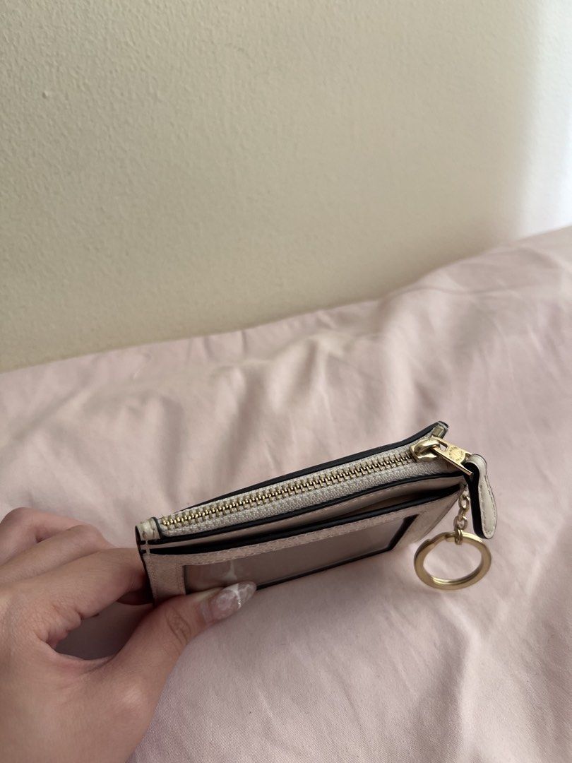 Coach Signature Canvas Card Holder (Category: Luxury Bags & Wallets) located in Manila. Submitted by coles.collection (Listing ID 1461397497, Image 3). Description: - Coach card holder in signature canvas (beige/white pattern) - Can pass as brand new - Bought this brandnew nung July lang - Zippered compartment for secure storage - Multiple card slots for organization.