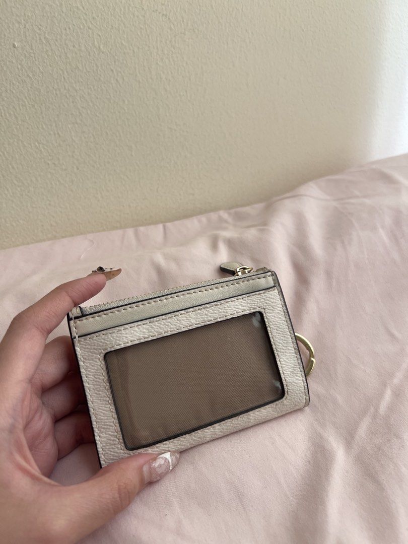 Coach Signature Canvas Card Holder (Category: Luxury Bags & Wallets) located in Manila. Submitted by coles.collection (Listing ID 1461397497, Image 2). Description: - Coach card holder in signature canvas (beige/white pattern) - Can pass as brand new - Bought this brandnew nung July lang - Zippered compartment for secure storage - Multiple card slots for organization.
