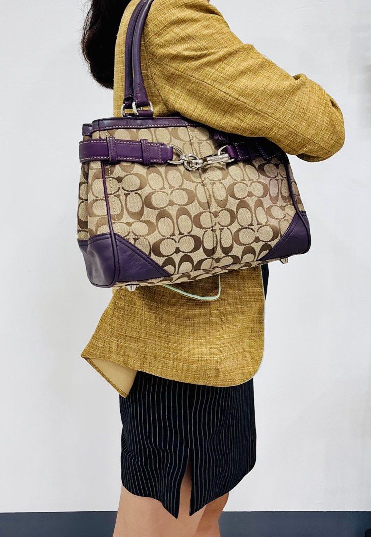 Coach Signature Monogram Canvas & Leather Shoulder Bag (Category: Luxury Bags & Wallets) located in Pasig City. Submitted by zen_it_all (Listing ID 1461470744, Image 3). Description: - Authentic Coach monogram canvas and leather handbag - Chic purple leather trim and handles - Elegant Silver-tone hardware -Jacket type zipper - Includes signature Coach hangtag and tassel -signs of usage (pre-loved) - Ample interior space for your essentials - Idea