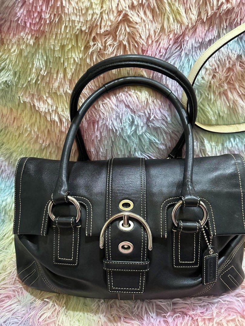 Coach Soho Black Leather Flap Satchel Bag (Category: Shoulder Bags) located in Bacacay. Submitted by curatedsbyjj (Listing ID 1461497631, Image 2). Description: Super classic and chic, perfect for everyday use or even for dressing up your outfit. Still in good condition. Still in good condition. It has some faded areas, although I’m not sure if these are part of the original design. Either way, they give it a nice worn-in, vintage look and add to