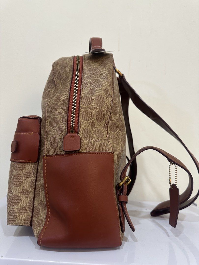 Coach x Disney Monogram Canvas Leather Backpack (Category: Backpacks) located in Malabon City. Submitted by everythingpreloveddd (Listing ID 1461375899, Image 2). Description: - Coach x Disney collaboration backpack - Signature monogram canvas with brown leather trim - Adjustable shoulder straps - Front zip pocket - Top handle - Ideal for everyday essentials - Shows minimal signs of wear.