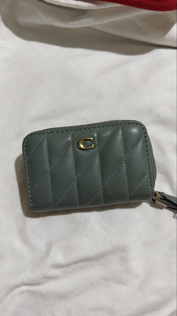 Coach zip around card case quilted (Category: Wallets & Card holders) located in Manila. Submitted by kennyyyyyyyyyy (Listing ID 1461522792, Image 1). Description: coach zip around card case quilted in SAGE color -8/10 condition -4,400 original price -100% original coach money back if proven fake -honest issue may fade marks SELLING FOR 3,000.