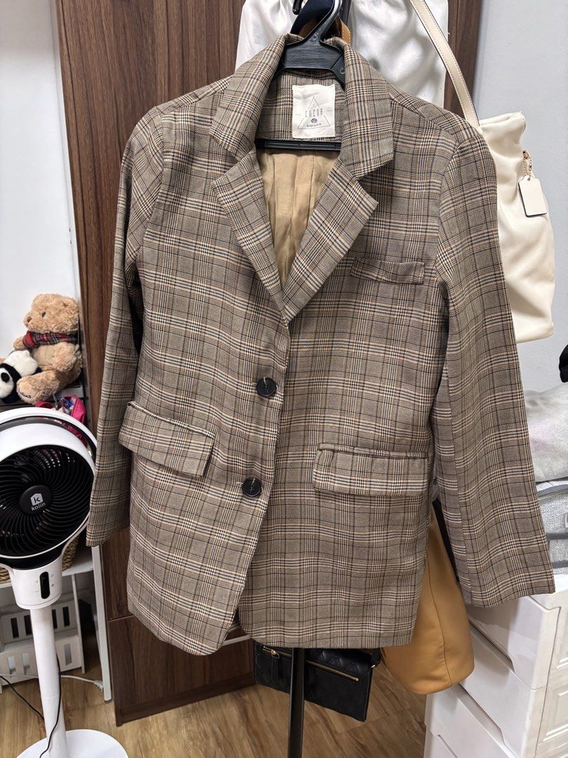 COCOA Design by Korea Plaid Blazer (Category: Coats, Jackets and Outerwear) located in Quezon City. Submitted by frodo0905 (Listing ID 1461444892, Image 1). Description: - Brown plaid blazer from COCOA - Korean design - Two front buttons - Two flap pockets - Fully lined with satin-like material - Ideal for layering over tops or dresses - Adds a smart touch to any outfit.