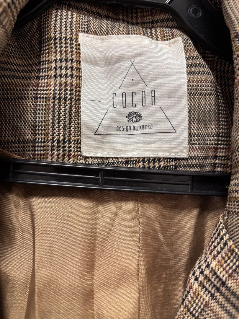 COCOA Design by Korea Plaid Blazer (Category: Coats, Jackets and Outerwear) located in Quezon City. Submitted by frodo0905 (Listing ID 1461444892, Image 2). Description: - Brown plaid blazer from COCOA - Korean design - Two front buttons - Two flap pockets - Fully lined with satin-like material - Ideal for layering over tops or dresses - Adds a smart touch to any outfit.