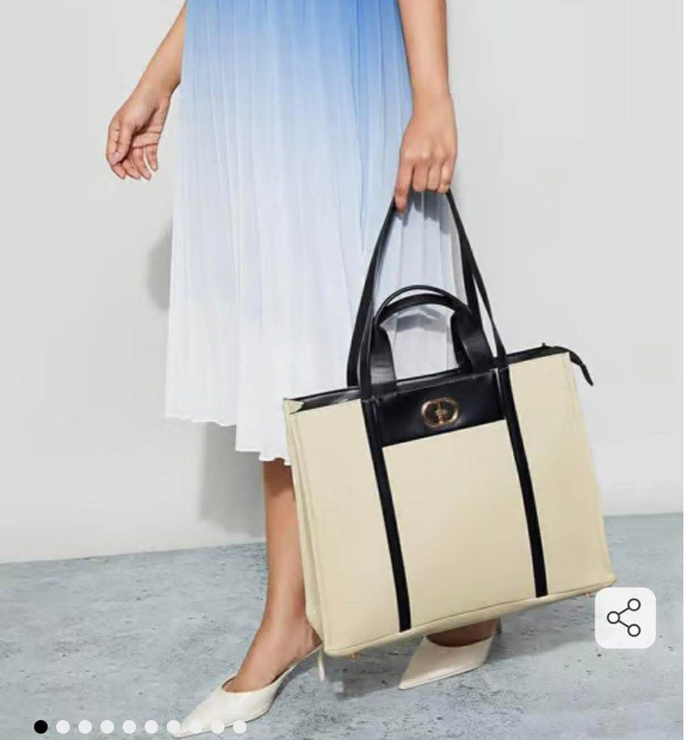 Code by lifestyle UAE brand tech-friendly woven shoulder bag (Category: Shoulder Bags) located in Mandaluyong City. Submitted by splashfashion.ph (Listing ID 1461383927, Image 1). Description: .