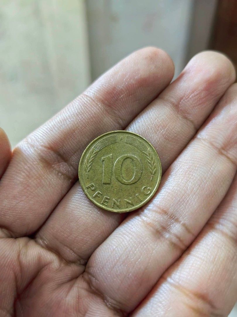 Coin - 1979 West German 10 Pfennig (Category: Currency) located in Cebu City. Submitted by dudes_villanueva (Listing ID 1461326617, Image 1). Description: Coin - 1979 West German 10 Pfennig coin featuring an oak leaf sprig design. 📌 Issuer: Federal Republic of Germany (West Germany) 📌 Denomination: 10 Pfennig 📌 Year: 1979 📌 Composition: Brass-plated steel 📌 Obverse/Reverse Design: Features an oak twig with leaves surrounded by the text "BUND