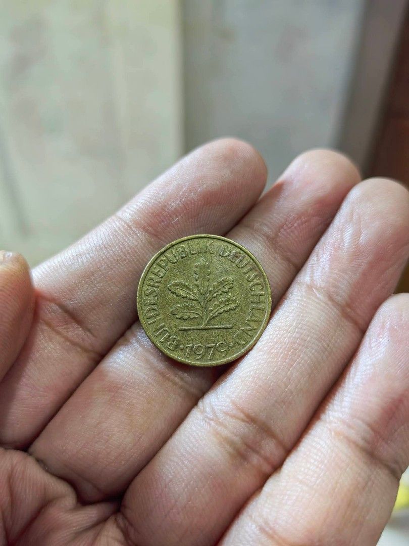 Coin - 1979 West German 10 Pfennig (Category: Currency) located in Cebu City. Submitted by dudes_villanueva (Listing ID 1461326617, Image 2). Description: Coin - 1979 West German 10 Pfennig coin featuring an oak leaf sprig design. 📌 Issuer: Federal Republic of Germany (West Germany) 📌 Denomination: 10 Pfennig 📌 Year: 1979 📌 Composition: Brass-plated steel 📌 Obverse/Reverse Design: Features an oak twig with leaves surrounded by the text "BUND