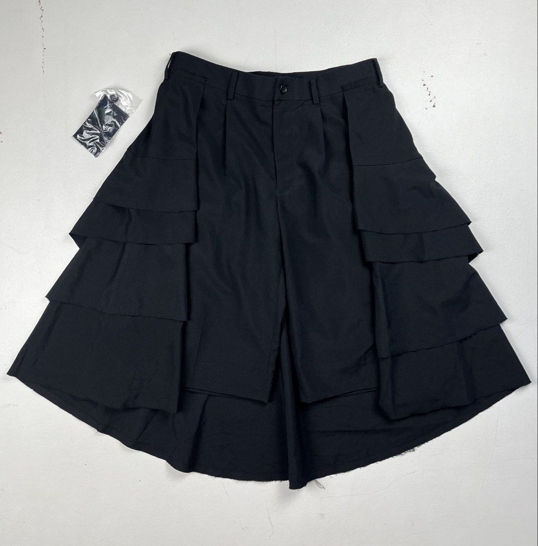 Comme des Garçons SS2017 Tiered Ruffled Skort Shorts (Category: Luxury Apparel) located in Quezon City. Submitted by forgarments (Listing ID 1461401078, Image 1). Description: Comme des Garçons SS2017 Tiered Ruffled Skort Shorts Excellent Condition with extra buttons & Fabric sample - Has a few Pin holes at the back tiered ruffle Size: small Waist: 29 inches Front rise: 10 inches Inseam: 12.5 inches Thigh: 12.5 inches Hem: 11 inches Short length: