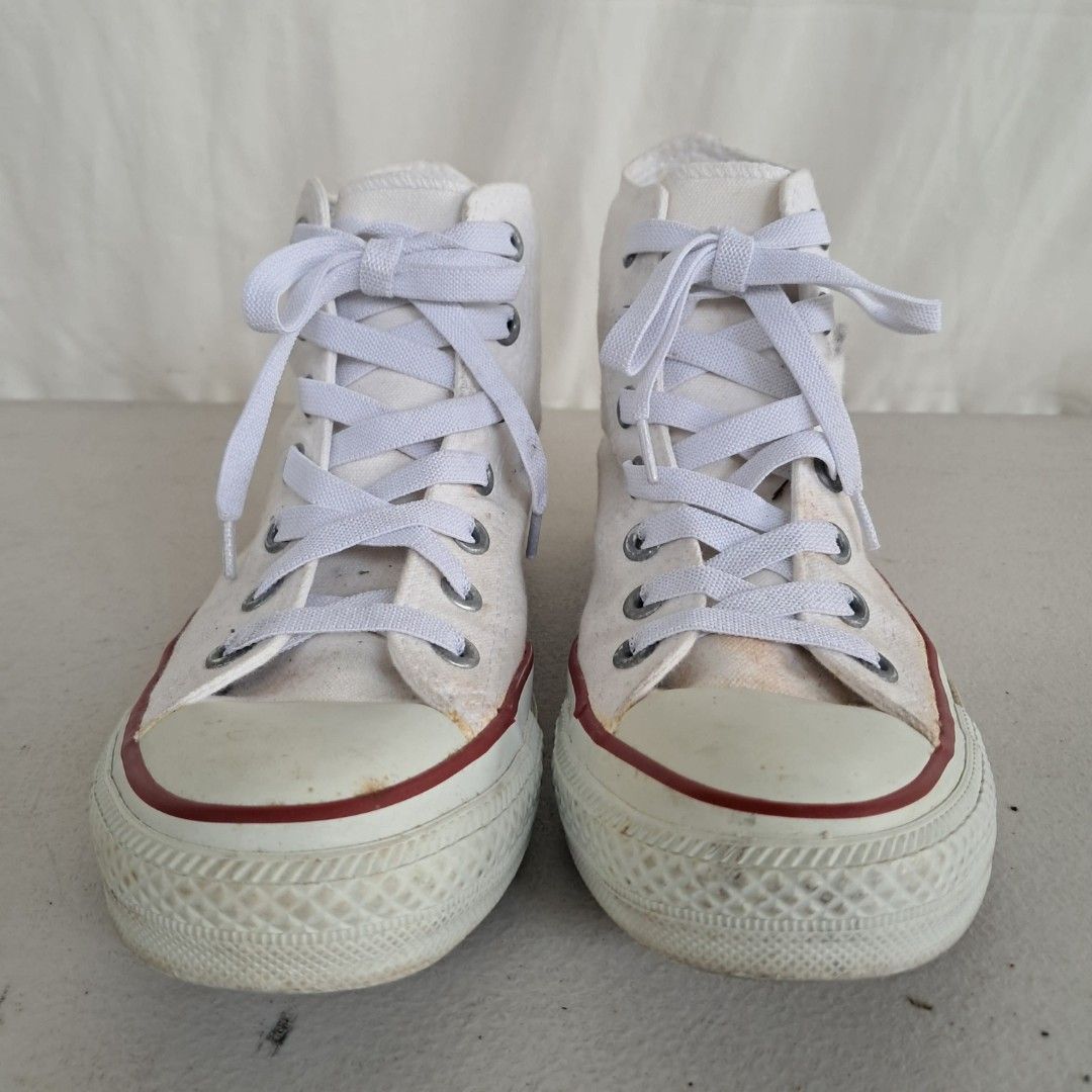 Converse All Star High Top White Canvas Sneakers (Category: Sneakers) located in Bulacan. Submitted by amarijapansurplus (Listing ID 1461432092, Image 2). Description: - US 4.5 / JPN 23.5 - 10" /26cm - classic white Converse high tops - Made of durable canvas material - Shows minor scuffs and dirt marks on soles and toe caps from regular wear - White laces included - Plenty of life left, perfect for everyday casual style.