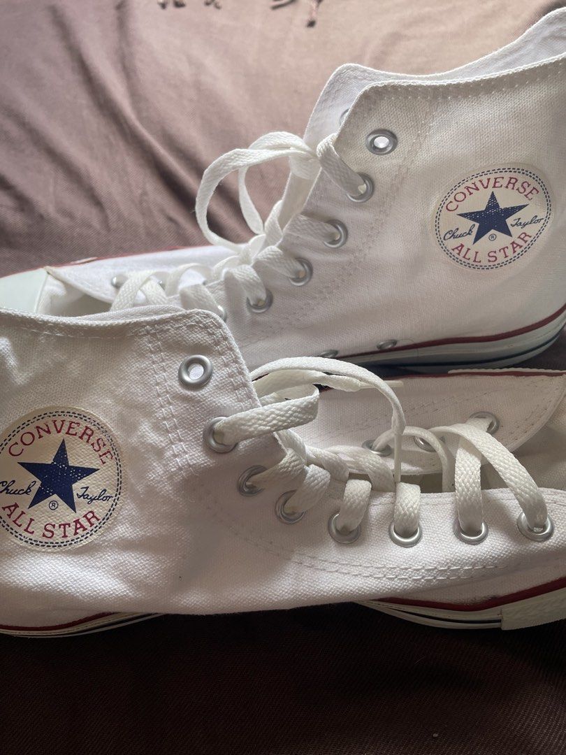 Converse Chuck Taylor All Star High Top White Canvas (Category: Sneakers) located in Manila. Submitted by silentlion.f6b795 (Listing ID 1461368301, Image 2). Description: - Classic white Converse high tops - Durable canvas material - Red stripe detail on the sole - Secure lace-up closure - Iconic Chuck Taylor All Star logo on the side - Versatile for everyday wear - A wardrobe essential.