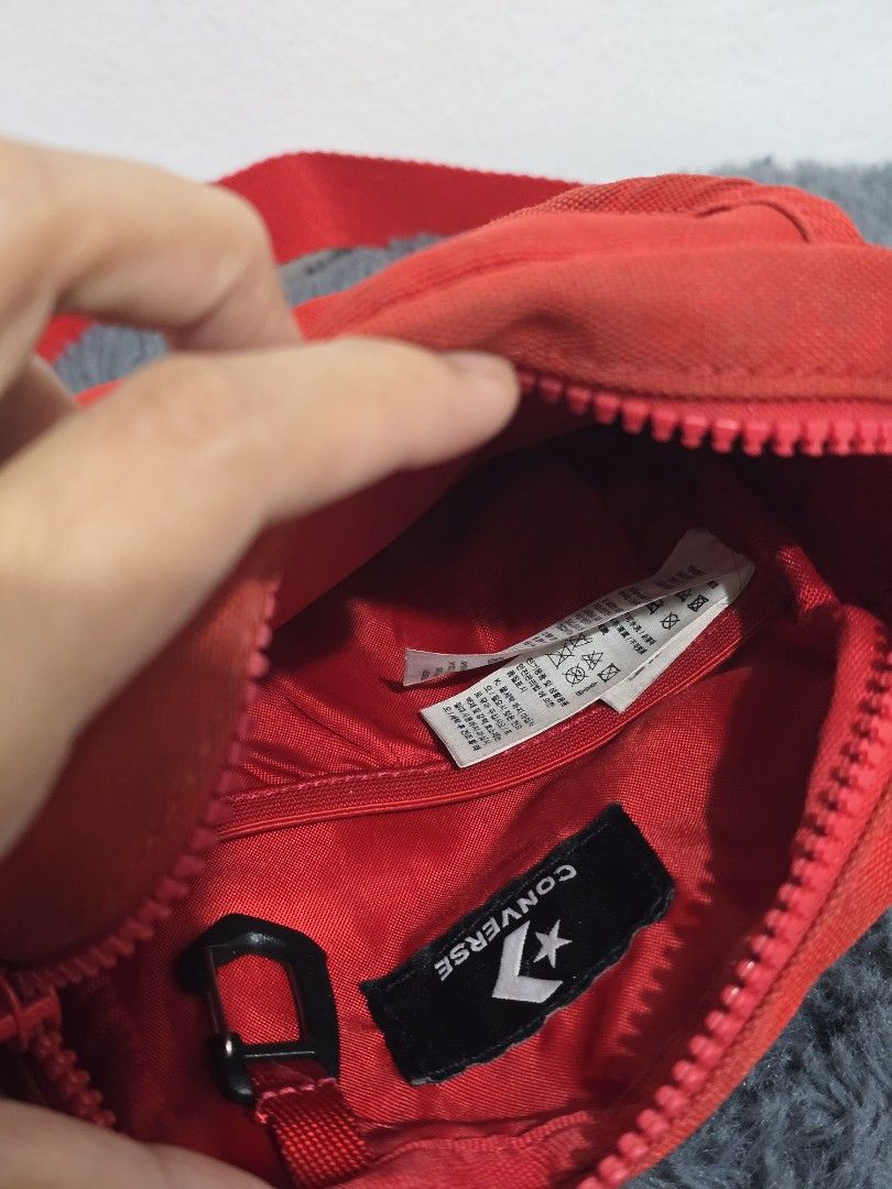 Converse Red Crossbody Bag (Category: Cross-body Bags) located in Manila. Submitted by trialfindsmanila (Listing ID 1461500172, Image 2). Description: This is authentic 💯 from US In good condition 💯 - Stylish red Converse crossbody bag - Main zippered compartment for secure storage - Front pocket with snap closure for quick access - Small zippered pocket on the back for extra organization - Adjustable strap for a comfortable fit - Ideal for car