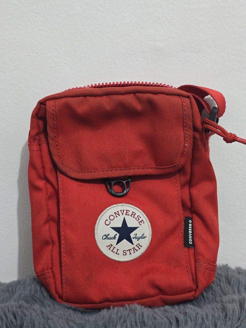 Converse Red Crossbody Bag (Category: Cross-body Bags) located in Manila. Submitted by trialfindsmanila (Listing ID 1461500172, Image 3). Description: This is authentic 💯 from US In good condition 💯 - Stylish red Converse crossbody bag - Main zippered compartment for secure storage - Front pocket with snap closure for quick access - Small zippered pocket on the back for extra organization - Adjustable strap for a comfortable fit - Ideal for car
