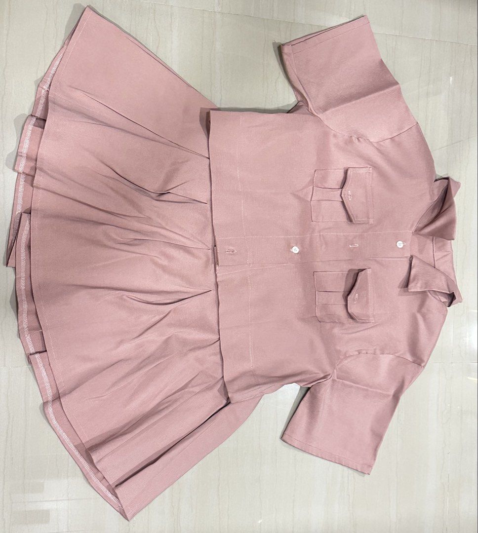 Coordinates (Category: Sets or Coordinates) located in Manila. Submitted by mystic-preloved (Listing ID 1461531826, Image 2). Description: - Item: 2-Piece Coordinates Set (Short-sleeve button-down top + pleated skirt) - Size: XL to 4xl - Color: Dust Pink / Rose Pink - Style: Cute preppy/schoolgirl aesthetic with front flap pockets and collared top - Condition: Preloved (Like new / Excellent condition) MODE OF PAYMENT: 🌸 MAYA 🌸 BPI 🌸 MARI BANK 