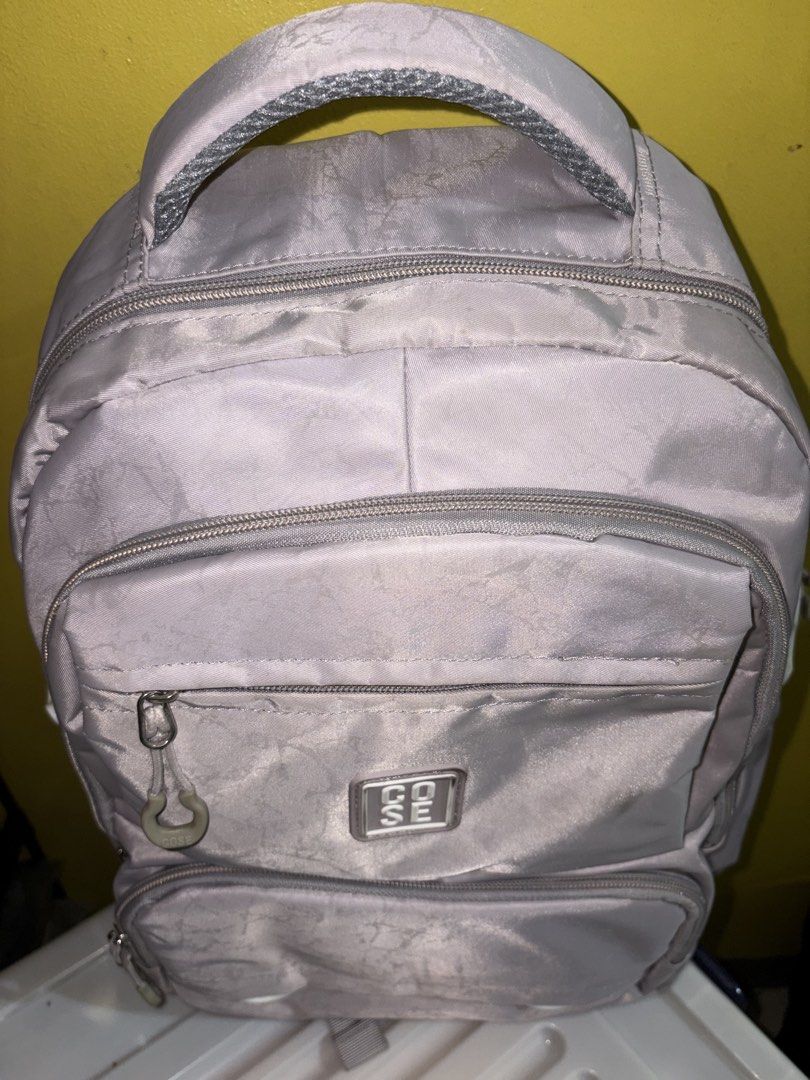 COSE Grey Backpack (Category: Backpacks) located in Manila. Submitted by cleverwater2528 (Listing ID 1461479935, Image 3). Description: - Brand: COSE - Color: Grey - Features: Multiple zippered compartments, spacious main compartment, front pocket for small items - Comfort: Padded straps - Ideal for: School, everyday use PRICE IS STILL NEGOTIABLE.