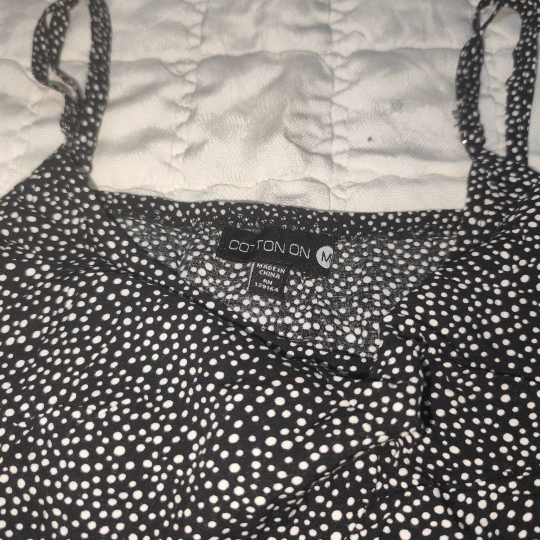 Cotton On Black Dotted Flowy Dress (Category: Dresses) located in Bacolod City. Submitted by dearicawho.56 (Listing ID 1461474032, Image 3). Description: - Cute black mini dress with white polka dots - Adjustable spaghetti straps - Ruffled detail on the bodice - Elasticated waist for a comfortable fit - Made from 100% viscose - Ideal for casual outings or beach days 🧾Mode of payment: 💙Gcash 💚GoTyme 🖤Maya 📍 Bacolod City. Negros Occidental .