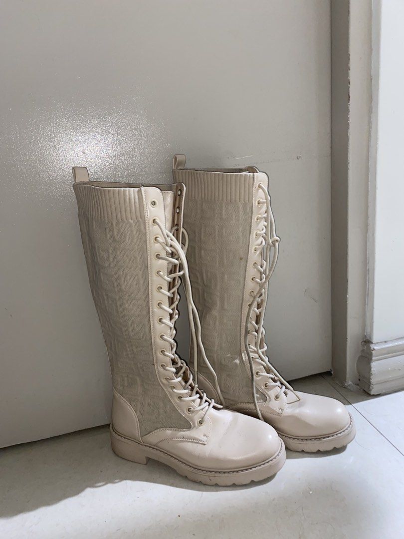 Cream-colored knee-high lace-up boots (Category: Dress Shoes) located in Manila. Submitted by labrhinth (Listing ID 1461525164, Image 1). Description: I can go lower for sure buyers All parts intact Minimal dirts but cleanable with wipes Size 38 but can fit well with 37-39 Can do meet up and lalamove.