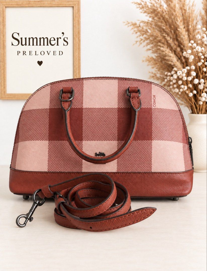 Cuching Dome Satchel (Category: Cross-body Bags) located in Taguig. Submitted by summers.preloved (Listing ID 1461514685, Image 2). Description: BAG DETAILS 🎀 Style: Dome Satchel 🩷 Color: Pink and Burgundy Check ✨ Material: Printed coated canvas with crossgrain leather details 🔒 Closure: Full zip-top closure 🧵 Lining: Coordinating fabric lining 👝 Interior: Spacious main compartment with multifunction pockets 📱 Exterior: Convenient outside s