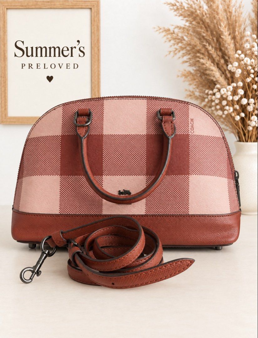 Cuching Dome Satchel (Category: Cross-body Bags) located in Taguig. Submitted by summers.preloved (Listing ID 1461514685, Image 1). Description: BAG DETAILS 🎀 Style: Dome Satchel 🩷 Color: Pink and Burgundy Check ✨ Material: Printed coated canvas with crossgrain leather details 🔒 Closure: Full zip-top closure 🧵 Lining: Coordinating fabric lining 👝 Interior: Spacious main compartment with multifunction pockets 📱 Exterior: Convenient outside s