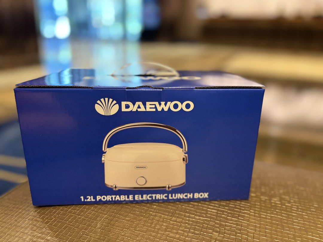 DAEWOO 1.2L Portable Electric Lunch Box (Category: Food Organization & Storage) located in Bulacan. Submitted by chariesannerivera (Listing ID 1461346537, Image 3). Description: - DAEWOO 1.2L Portable Electric Lunch Box - Compact and convenient for home or car use - Durable 304 stainless steel inner lunch box - Includes spoon and fork box - Safety features: Dry burn protection and indicator light - Easy to carry with built-in handle.