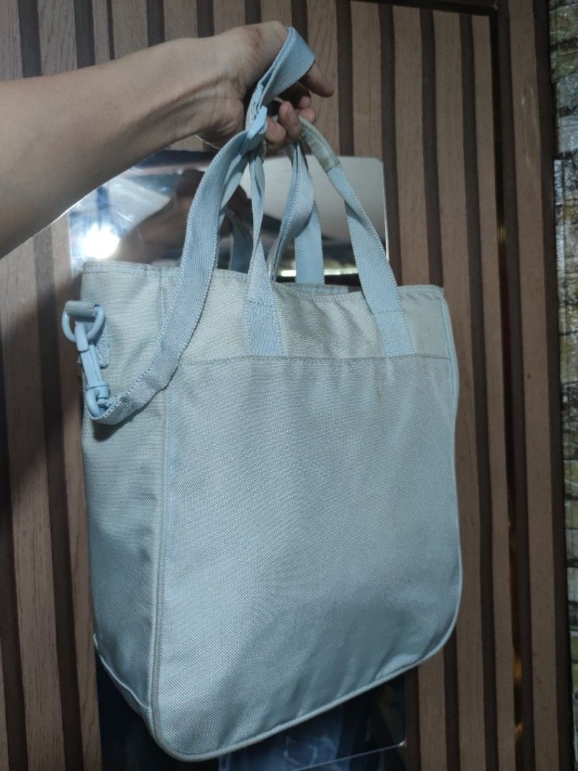 Daks Light Blue Tote Bag with Shoulder Strap (Category: Tote Bags) located in Dagupan City. Submitted by jhazrightshop (Listing ID 1461444013, Image 2). Description: - Brand: Daks - Color: Light Blue - Style: Tote Bag - Features: Top handles, detachable shoulder strap - Material: Subtle textured fabric - Detail: Decorative band with sparkly accent on the front - Interior: Light blue - Ideal for: Everyday use.