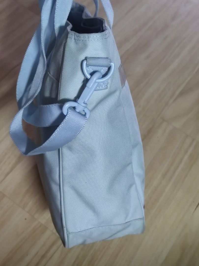 Daks Light Blue Tote Bag with Shoulder Strap (Category: Tote Bags) located in Dagupan City. Submitted by jhazrightshop (Listing ID 1461444013, Image 3). Description: - Brand: Daks - Color: Light Blue - Style: Tote Bag - Features: Top handles, detachable shoulder strap - Material: Subtle textured fabric - Detail: Decorative band with sparkly accent on the front - Interior: Light blue - Ideal for: Everyday use.