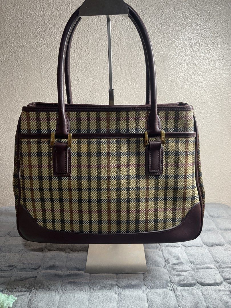 DAKS Plaid Leather Trim Hand Bag (Category: Tote Bags) located in Quezon City. Submitted by donnabelle7572 (Listing ID 1461439271, Image 2). Description: - Classic DAKS Hand bag - Timeless plaid pattern with rich leather trim - Spacious interior for essentials - Elegant gold-tone hardware - Comfortable top handles for easy carrying - Stylish everyday bag.