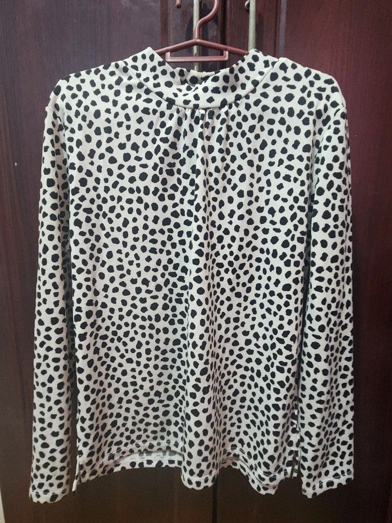 Dalmatian Print Long Sleeve Top (Category: Longsleeves) located in Muntinlupa City. Submitted by yanyan1888 (Listing ID 1461371570, Image 1). Description: - Stylish white top with a black dalmatian print - Long sleeves - High neckline design - Fabric has a slight sheen - Versatile for layering or standalone wear.