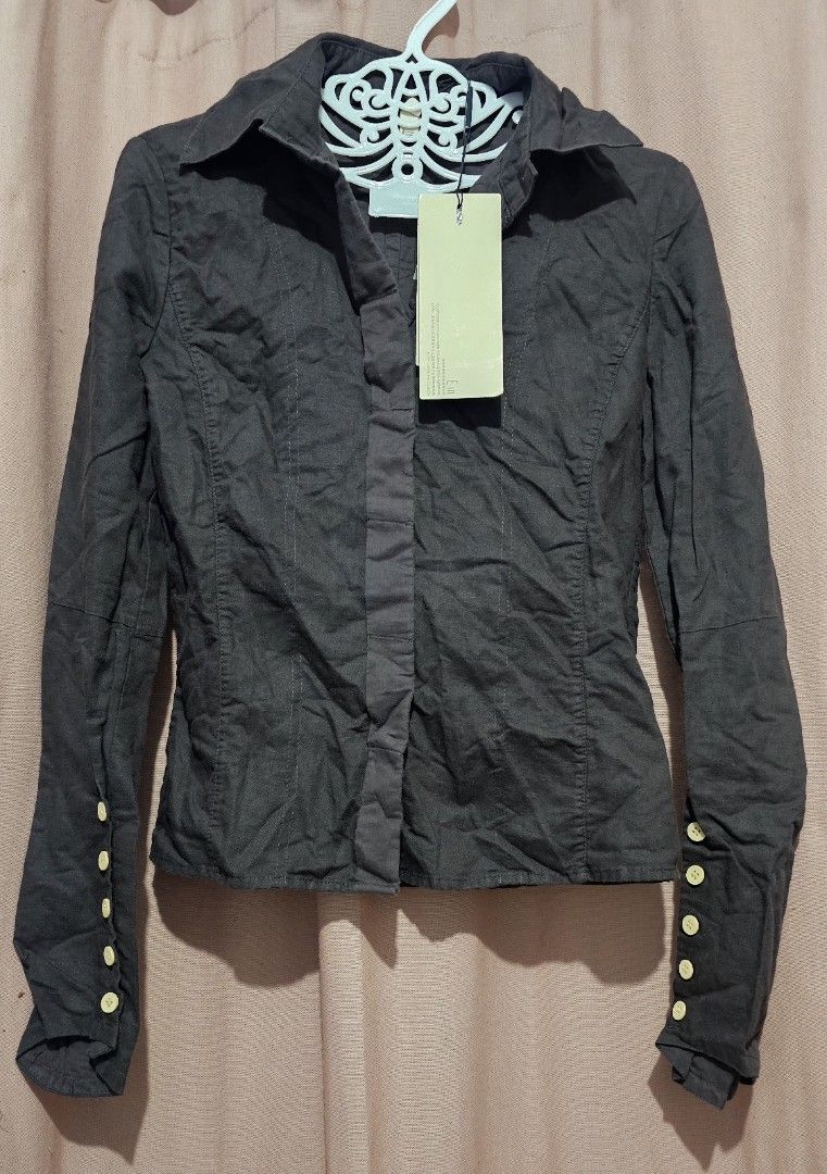 Dark Brown Button-Up Shirt with Gold Buttons (Category: Longsleeves) located in San Jose del Monte. Submitted by stellarbeauty (Listing ID 1461440157, Image 1). Description: - Brand new dark brown long-sleeved shirt - Still has original tag attached - Button-up front with collared neckline - Decorative gold buttons on cuffs - Subtle textured fabric for a refined look.