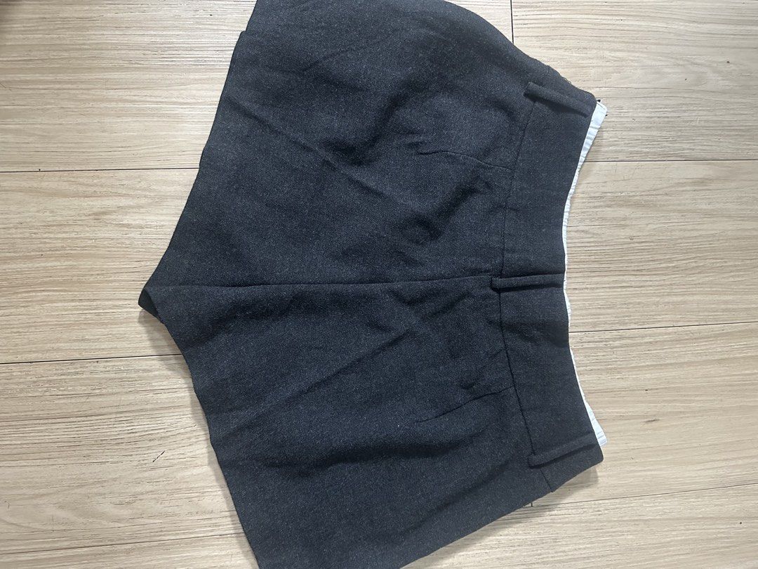 Dark Grey Pleated Skirt Shorts (Category: Skirts) located in Bacolod City. Submitted by kristellelopez (Listing ID 1461355488, Image 2). Description: - Dark grey skirt shorts with pleats - Elastic waistband with buckle detail - School uniform inspired style - Versatile for casual wear or costumes - Comfortable and stylish design.