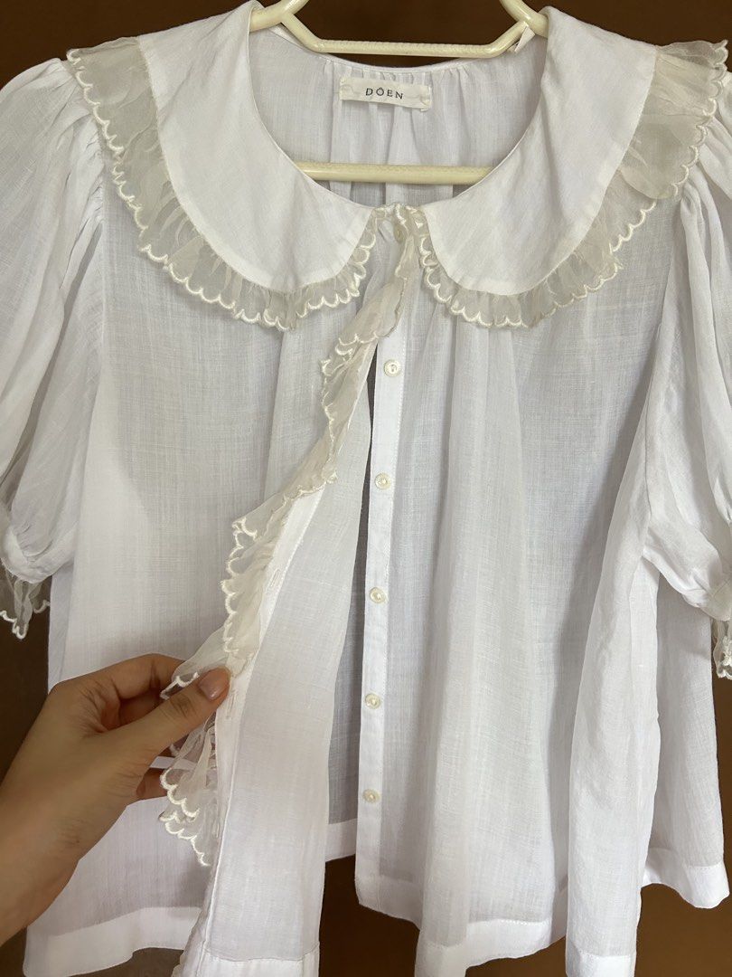 DÔEN Frilly Linen White Top (Category: Blouses) located in Manila. Submitted by anothermanxtreasure (Listing ID 1461397785, Image 3). Description: Authentic Dôen brand Size M In great condition! Retails for 20k ++.