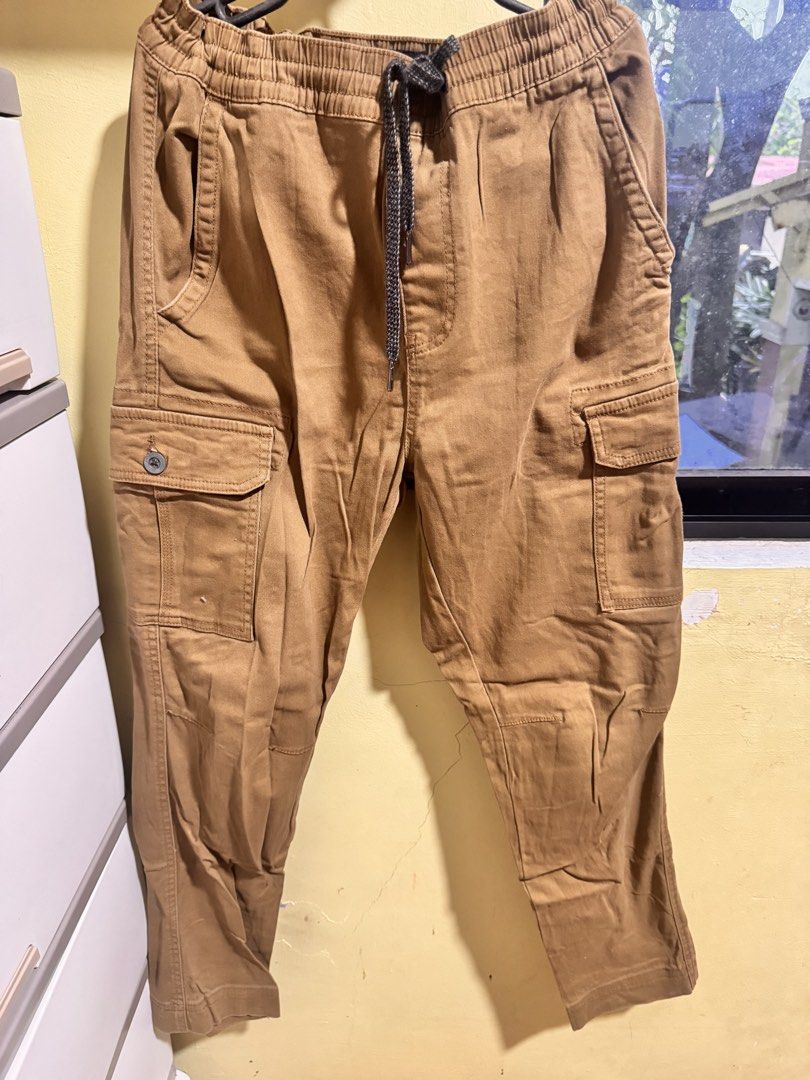 Denali Cargo Pants Size M (32/34) Tan (Category: Jeans) located in Obando. Submitted by Wintermelonzzzz (Listing ID 1461334157, Image 1). Description: - Brand: Denali - Color: Tan - Style: Cargo Pants - Size: Medium (fits waist 32-34) - Features: Elastic waistband with drawstring, multiple pockets - Origin: Made in Bangladesh - Ideal for: Casual wear.