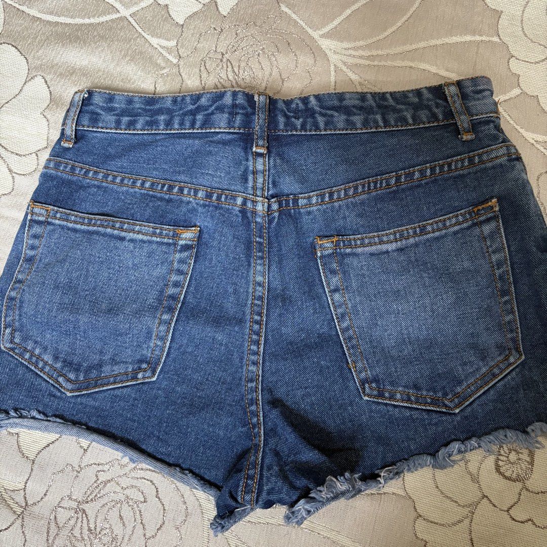 Denim Cut-Off Shorts (Category: Shorts) located in Las Pinas. Submitted by miffy256 (Listing ID 1461336387, Image 3). Description: Forever 21 Blue Denim Shorts - Size 27 (Small to Medium) - Button up closure - Mini shorts - Blue denim wash .