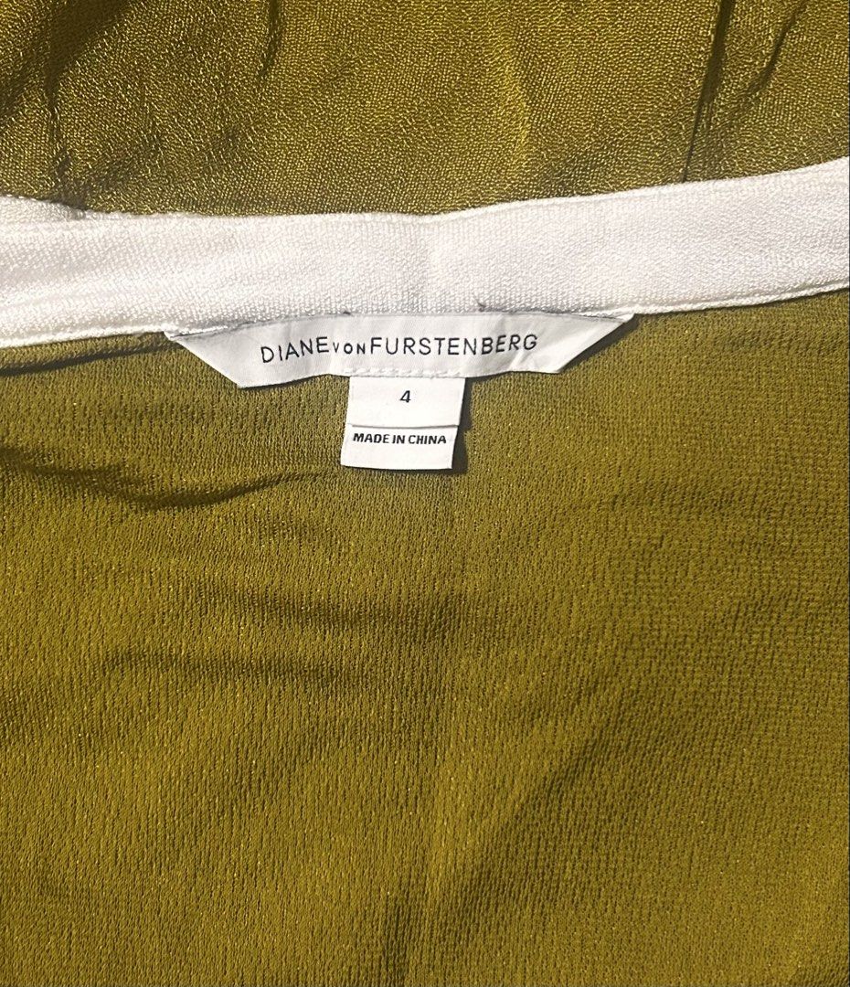 DIANE VON FURSTENBERG (Category: Rompers) located in Davao. Submitted by sart0ria85 (Listing ID 1461408605, Image 2). Description: A metallic, sexy romper of dark yellow mustard with white linings. 100% VISCOSE MADE IN CHINA 🇨🇳 SMALL. Size 4 EXCELLENT CONDITION (91/100).