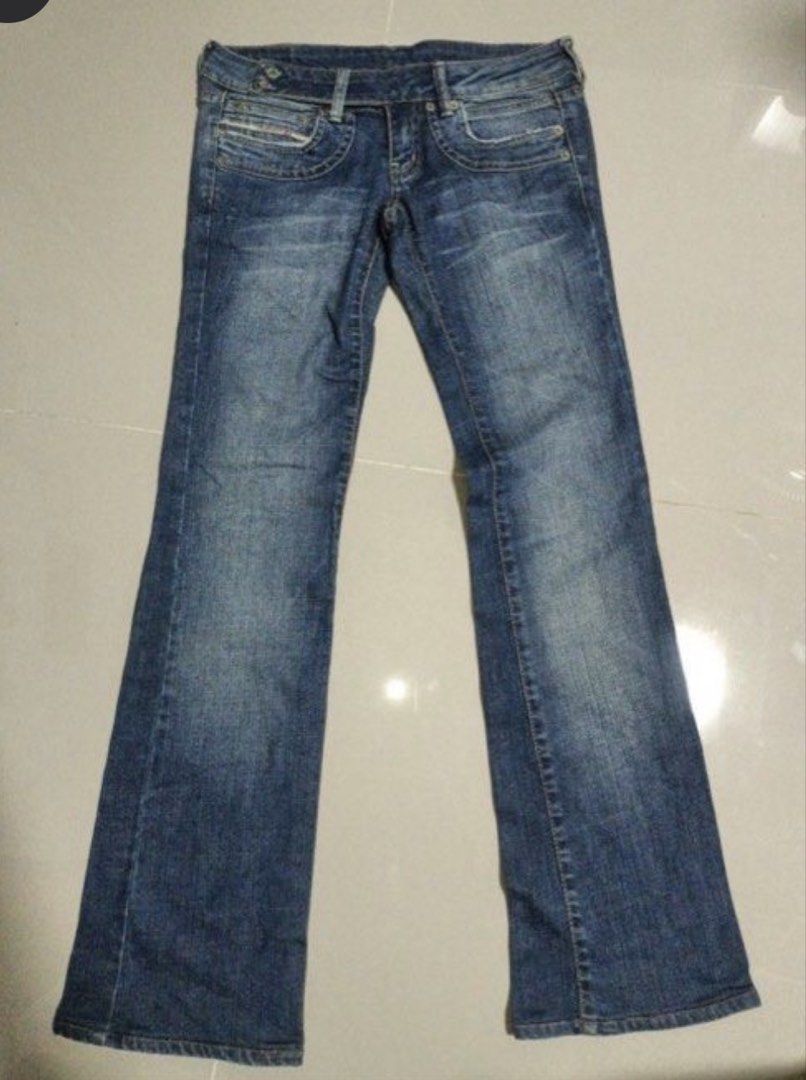 DIESEL double buttons low rise flared pants (Category: Jeans) located in Manila. Submitted by jashdeclutters (Listing ID 1461453407, Image 1). Description: - Classic blue denim jeans from Diesel Industry - 2 buttons - Made in Italy - fits size 26-27 waist - Bootcut or flared leg opening - Faded wash with whiskering for a vintage look - Ideal for everyday wear.