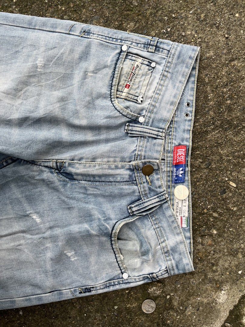 DIESEL X ADIDAS (Category: Jeans) located in Gapan. Submitted by jamminandcrackin (Listing ID 1461428716, Image 3). Description: - Brand: Diesel - Style: Light wash denim jeans - Fit: Straight leg - Details: Distressed areas and fading - Features: Classic Diesel logo on coin pocket and back waistband - Special: Inner lining with Adidas collaboration print - Occasion: Great for everyday wear.