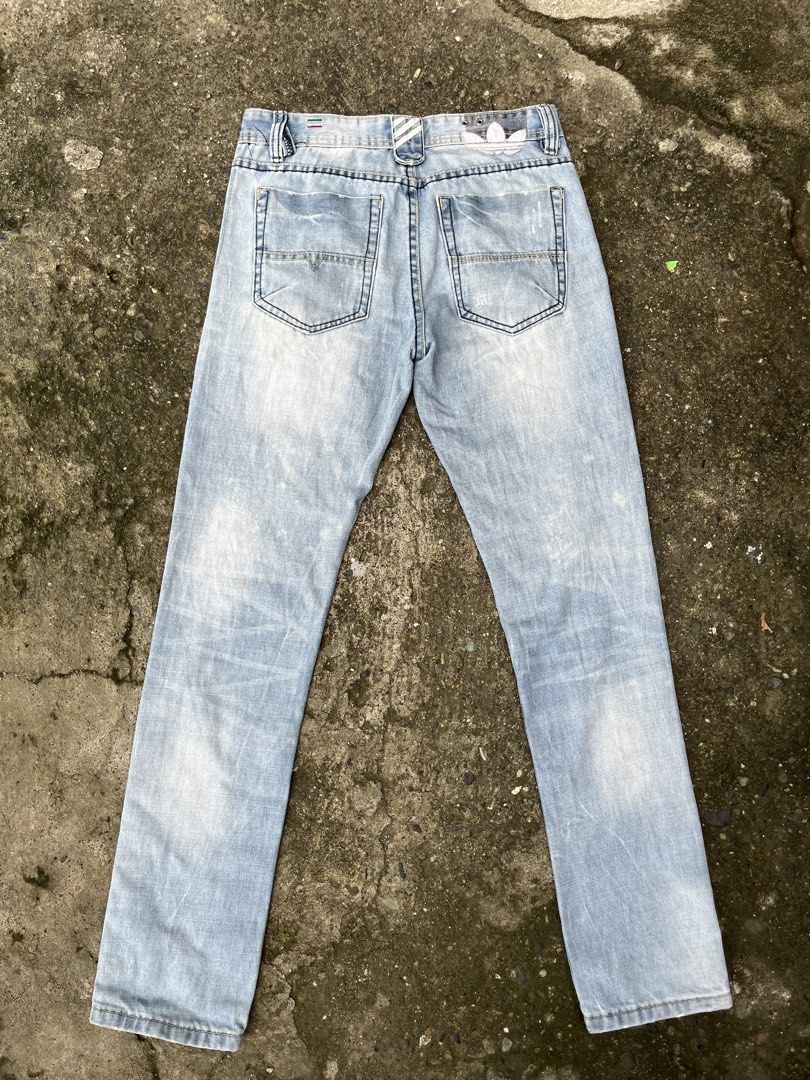 DIESEL X ADIDAS (Category: Jeans) located in Gapan. Submitted by jamminandcrackin (Listing ID 1461428716, Image 2). Description: - Brand: Diesel - Style: Light wash denim jeans - Fit: Straight leg - Details: Distressed areas and fading - Features: Classic Diesel logo on coin pocket and back waistband - Special: Inner lining with Adidas collaboration print - Occasion: Great for everyday wear.