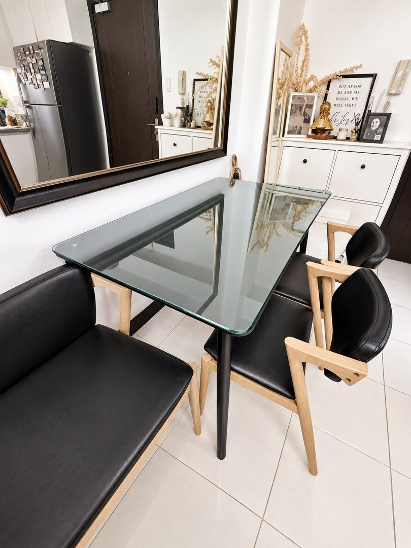 Dining Set (Category: Tables & Sets) located in Mandaluyong City. Submitted by enyscloset (Listing ID 1461424619, Image 2). Description: - Sleek Ikea lisabo dining table - 4x Comfortable black leather seat chair - Ideal for home, office, study area, or workspace - Dining table glass top included - Mandaluyong Area - Negotiable.