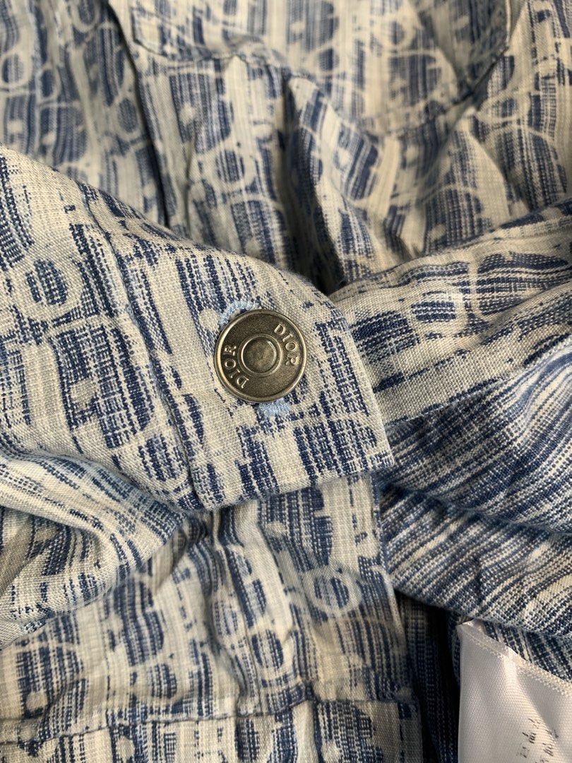 Dior Monogram Short Sleeve Button Up Shirt (Category: Shirts) located in Davao. Submitted by cheineebau09680 (Listing ID 1461475982, Image 3). Description: - Classic Dior monogram shirt - Iconic blue and white pattern - Short sleeves - Button-up front - Lightweight fabric, ideal for warm weather - Stylish addition to your wardrobe - Please check label for sizing.