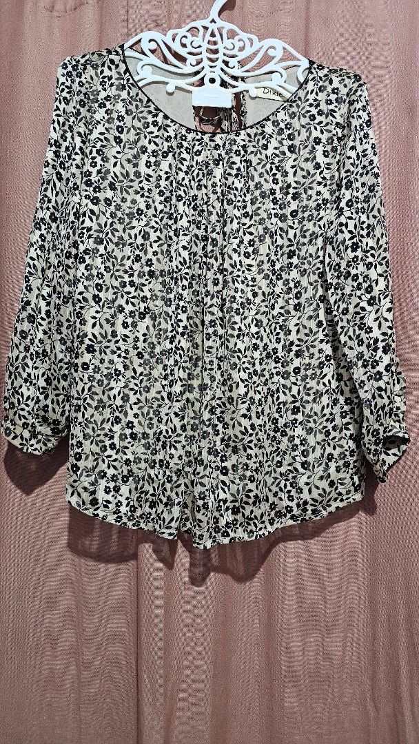 Dixie Floral Print Blouse (Category: Blouses) located in San Jose del Monte. Submitted by stellarbeauty (Listing ID 1461420146, Image 1). Description: - Lightweight floral print blouse - Features a gathered neckline - Long sleeves - Subtle textured fabric - Versatile: dress up or down, great for layering.