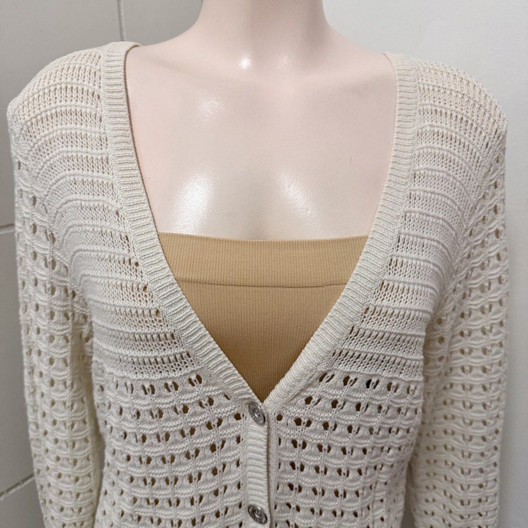 DKNY JEANS Ivory Button-Up Cardigan [L] (Category: Coats, Jackets and Outerwear) located in Malabon City. Submitted by k_intimates (Listing ID 1461549384, Image 3). Description: Details: • Size large • No issues • Ivory open-knit button-up cardigan featuring a lightweight perforated pattern and a classic V-neckline..