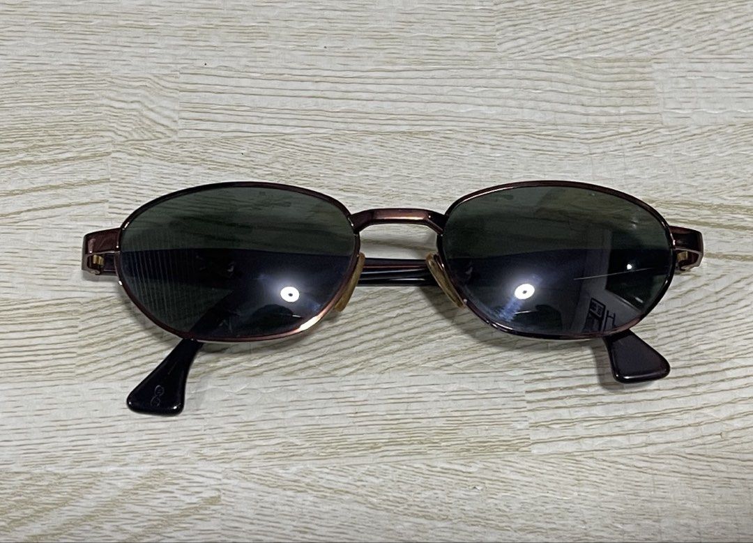 Donna Karan Eyewear Sunglasses with Case (Category: Sunglasses & Eyewear) located in Quezon City. Submitted by pamela.juan (Listing ID 1461366428, Image 2). Description: -VINTAGE / CLASSIC Y2k SUNGLASSES - AUTHENTIC Donna Karan - Style: Vintage/Classic Oval shaped sunglasses - Frame: Subtle metallic - Includes: Original hard case (embossed 'DONNA KARAN EYEWEAR' inside) rfs: doesn’t suit my face shape. Note: Shipping fee to be shouldered by the bu
