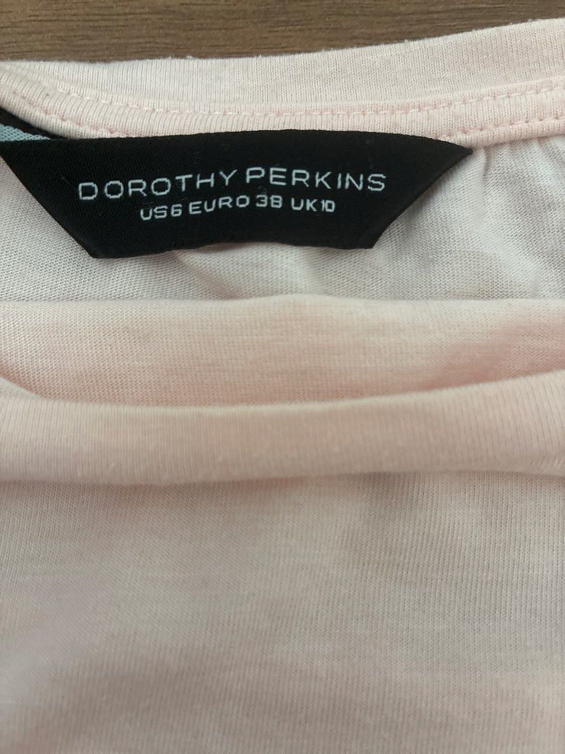 Dorothy Perkins Pink Pleated Tunic Top (Category: Blouses) located in Pasig City. Submitted by slr1949 (Listing ID 1461561867, Image 3). Description: - Light pink tunic top - Brand: Dorothy Perkins - Features a pleated front detail - Short sleeves - Relaxed fit - Ideal for casual wear - Easy to pair with jeans or leggings.