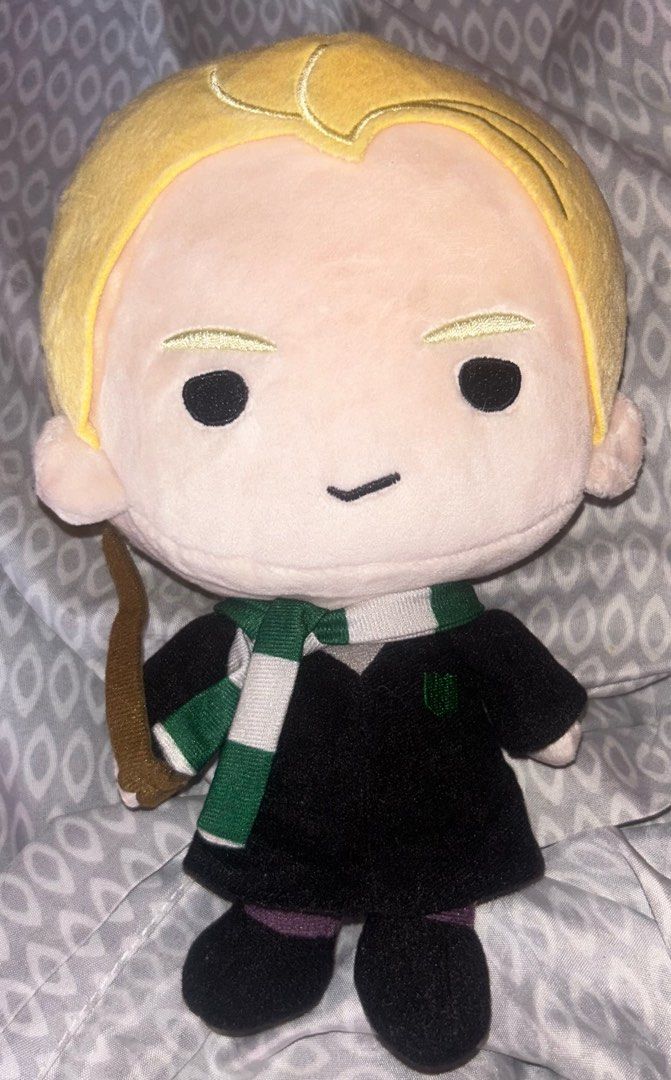 Draco Malfoy Plush Toy (Category: Plushies & Soft Toys) located in Bulacan. Submitted by declutteringthing_s (Listing ID 1461433466, Image 1). Description: - Adorable Draco Malfoy plush toy - Features Hogwarts uniform with green and white scarf - Comes with a wand accessory - Ideal for any Harry Potter enthusiast - Great for display or cuddling.