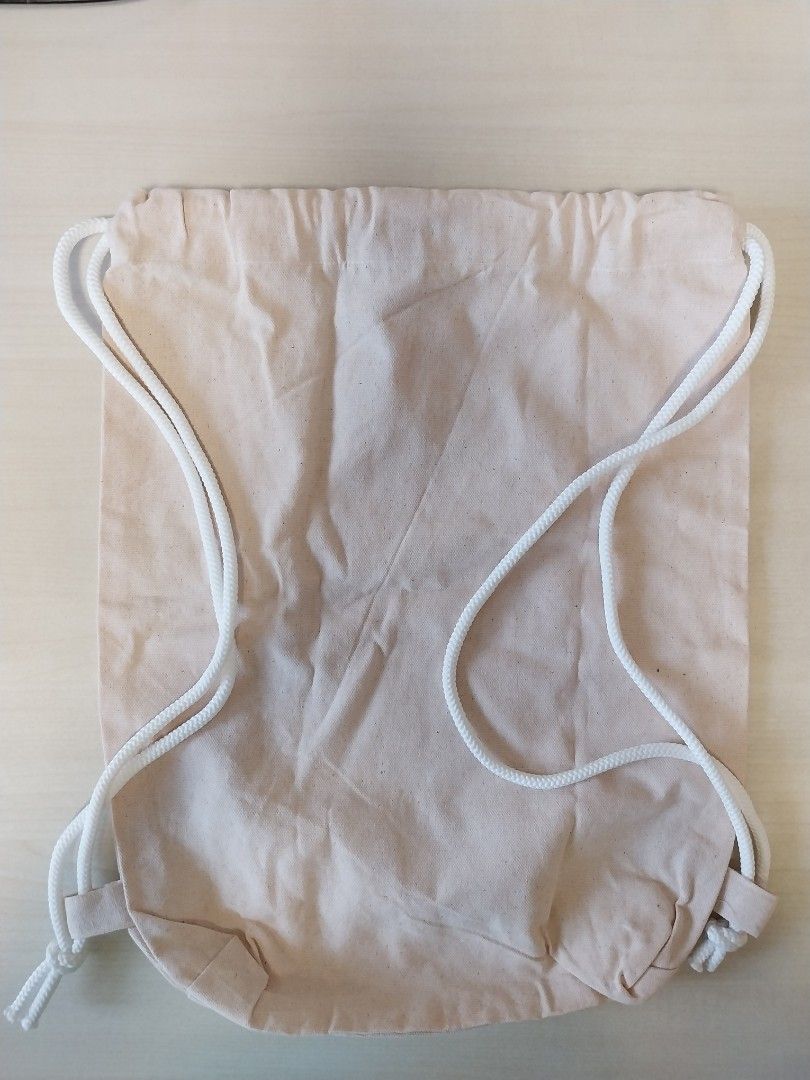 Drawstring bag (Category: Backpacks) located in Singapore. Submitted by TTS11 (Listing ID 1461403221, Image 1). Description: 42 x 33 cm gunny sack material.
