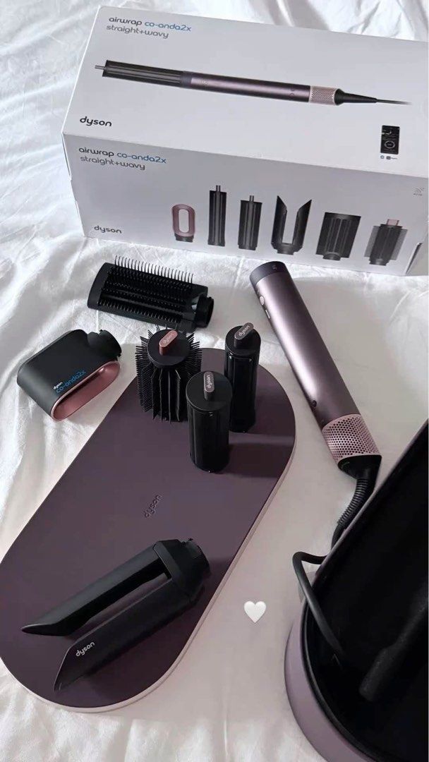Dyson Airwrap Co-anda 2x Jasper Plum (Category: Hair) located in Quezon City. Submitted by veeree0823 (Listing ID 1461325728, Image 2). Description: - Dyson Airwrap Complete set - Includes Co-anda 2x barrels for straight and wavy styles - Comes with various attachments: brushes and smoothing dryers - All pieces fit neatly into the storage case - Great for styling hair at home Twice used. Can pass as brand new. Complete with box. Prenup and weddin