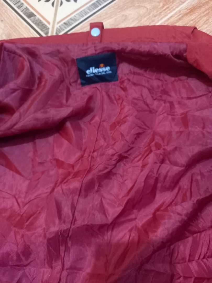 Ellesse Red Jacket with Grey Inner (Category: Coats, Jackets and Outerwear) located in Baguio. Submitted by jonandaya (Listing ID 1461557569, Image 2). Description: - Red Ellesse jacket - Grey checkered inner lining - Two front pockets - Ideal for cooler weather - Great for casual wear -26x31 XXL.