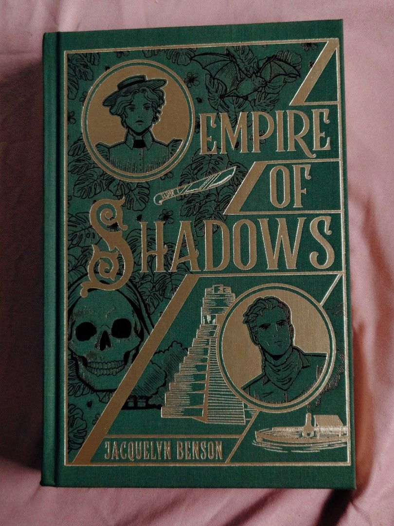 Empire of Shadows - Signed Special Edition (Category: Storybooks) located in Batangas. Submitted by eliza.reads.and.rehomes (Listing ID 1461343606, Image 1). Description: MOP: GCASH MOD: J&T EXPRESS ON HAND Signed -Green cloth mercerized cotton binding featuring an original design with gold and black foil stamping. -Rough-cut deckled page edges, a built-in gold ribbon bookmark, and custom patterned endpapers. - Includes Victorian-style black-and-